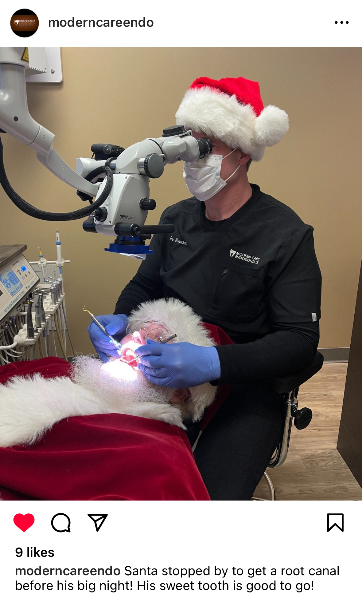 The image shows a person dressed as Santa Claus having a dental procedure under a microscope performed by a dentist. The dentist, wearing a mask and a black clinic uniform labeled "Modern Care Endodontics", is attending to Santa, who is reclined in a dental chair. The humorous caption indicates that Santa is getting a root canal to prepare for his big night, ensuring his sweet tooth is in good shape.